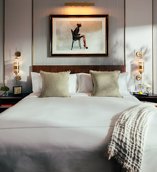 Bedroom with artwork and gold accents