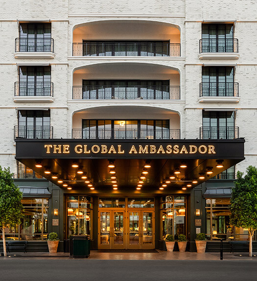 The Global Ambassador exterior valet area with soft lighting