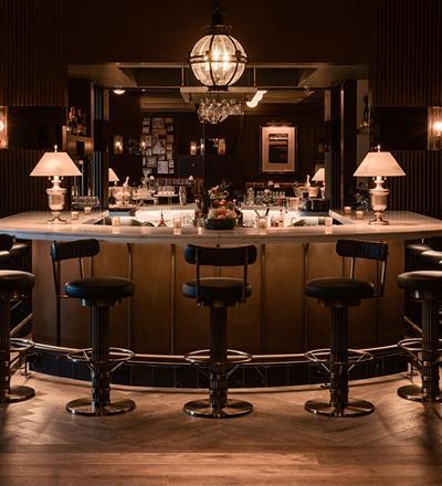 Chairs sitting around a bar