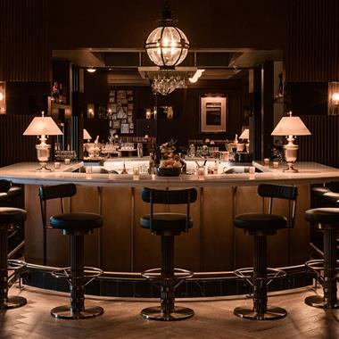 Stools in front of a fancy bar